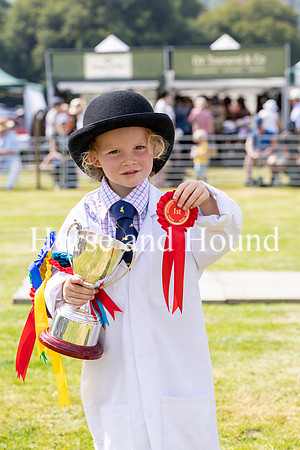 Rydale023 Grace Cummings 3.5yrs with the trophy for winner of the Brood Bitch Beagle won by Blackmore Crinkle