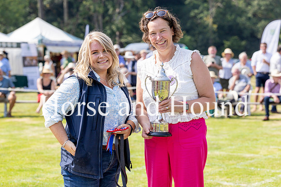 Rydale037 Gillian Todd is presented with the Robert Logan Memeorial Trophy for Champion Foxhound by Chairman Claire Logan-Stephens